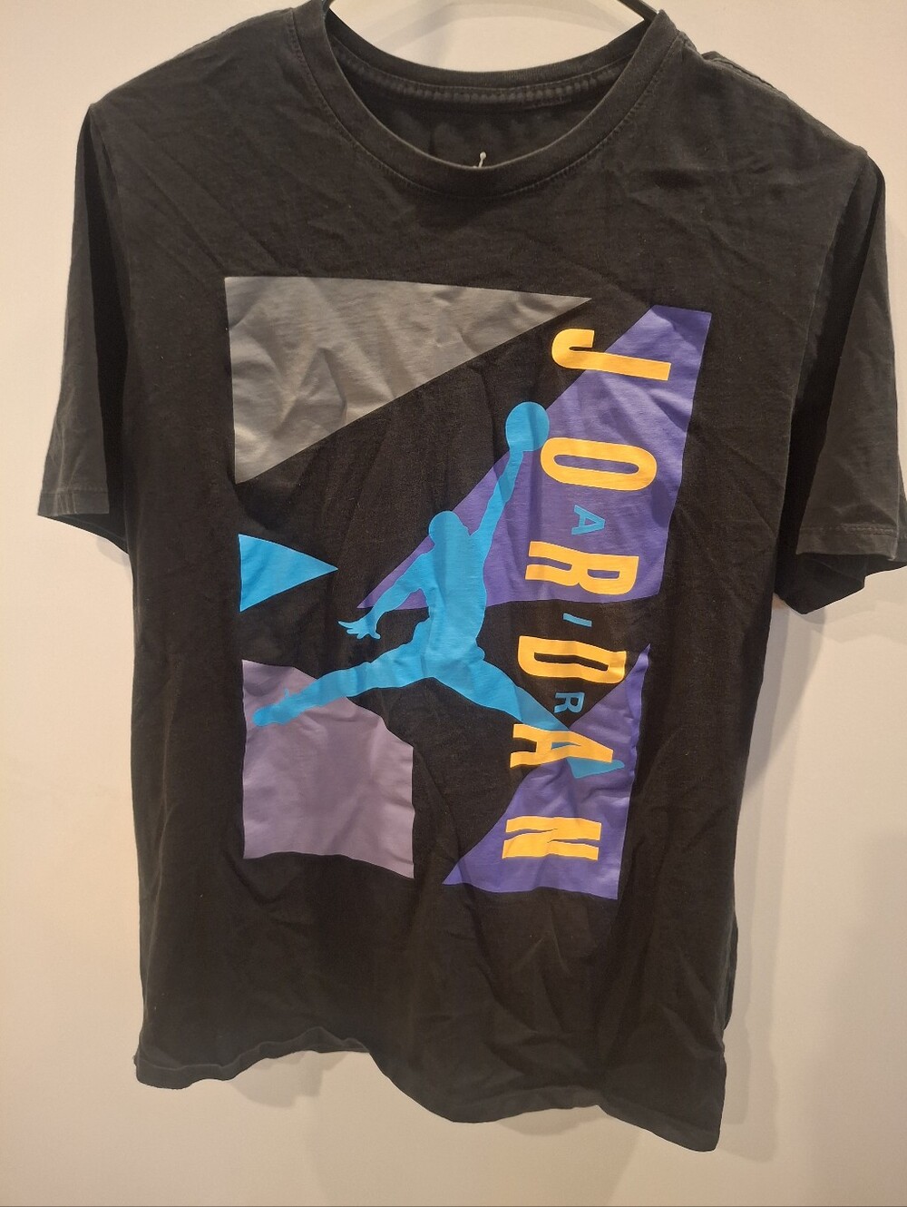 Jordan Black Short-Sleeve Graphic Tee with Teal, Purple and Yellow Print